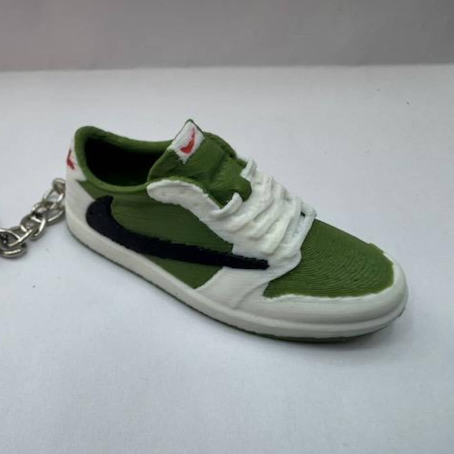 Tribute keyring to a Nike air Travis special edition trainer